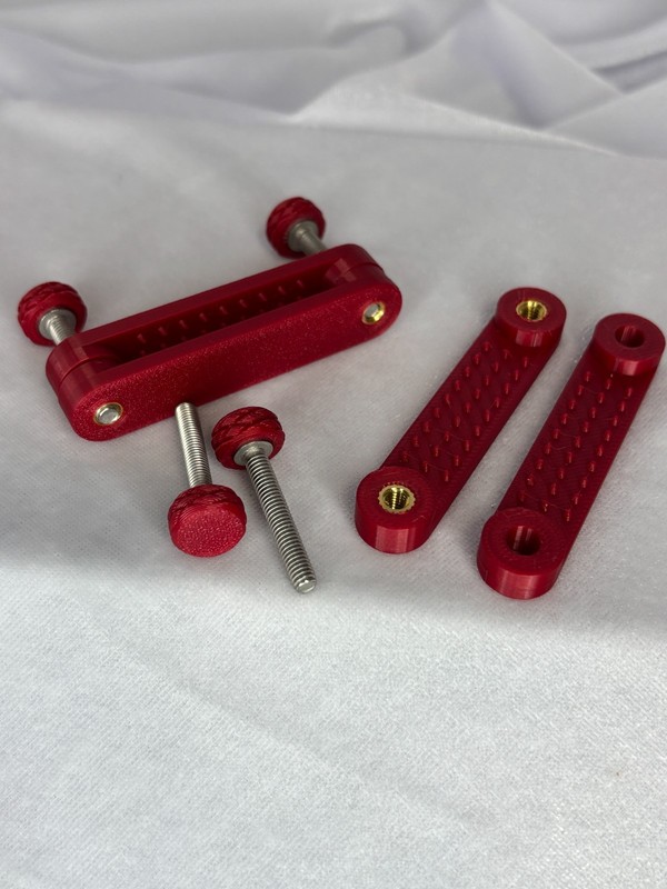 Custom Designed ruby red Nipple Bar Clamps (medium bite) gallery