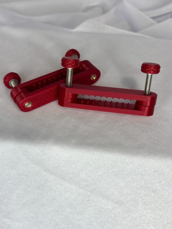 Custom Designed ruby red Nipple Bar Clamps (medium bite) gallery