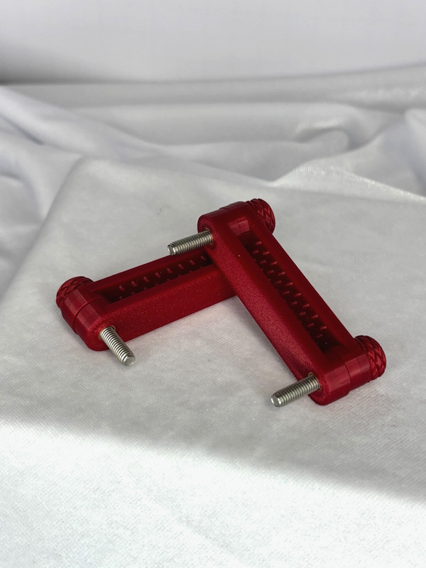 Custom Designed ruby red Nipple Bar Clamps (medium bite) gallery